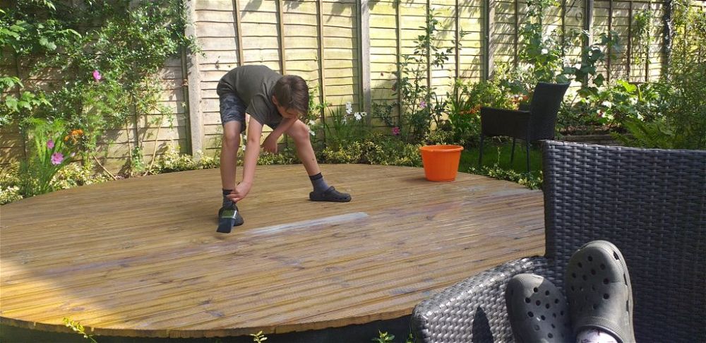 child painting decking oil